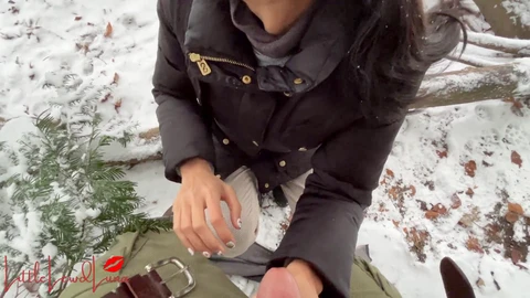 Asian babe gives blowjob in the snow while Luna takes on a big cock in a park, risking exposure!